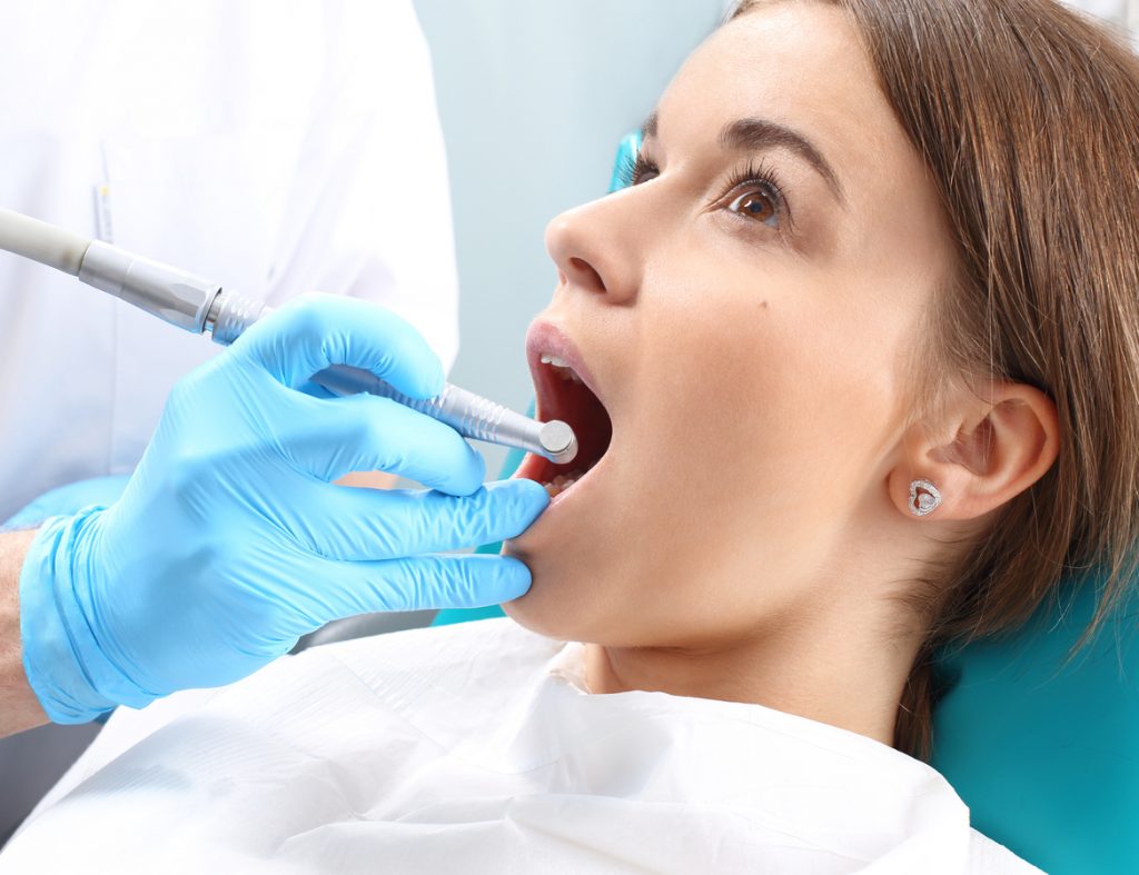 Experienced Dentist checkup the teeth in Brant Hills, ON