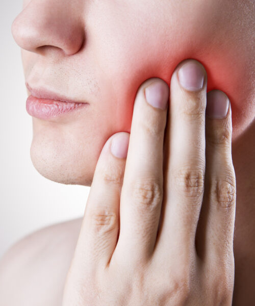 Man with a toothache. Pain in the human body A woman feels wisdom teeth pain and needs wisdom teeth removal near me